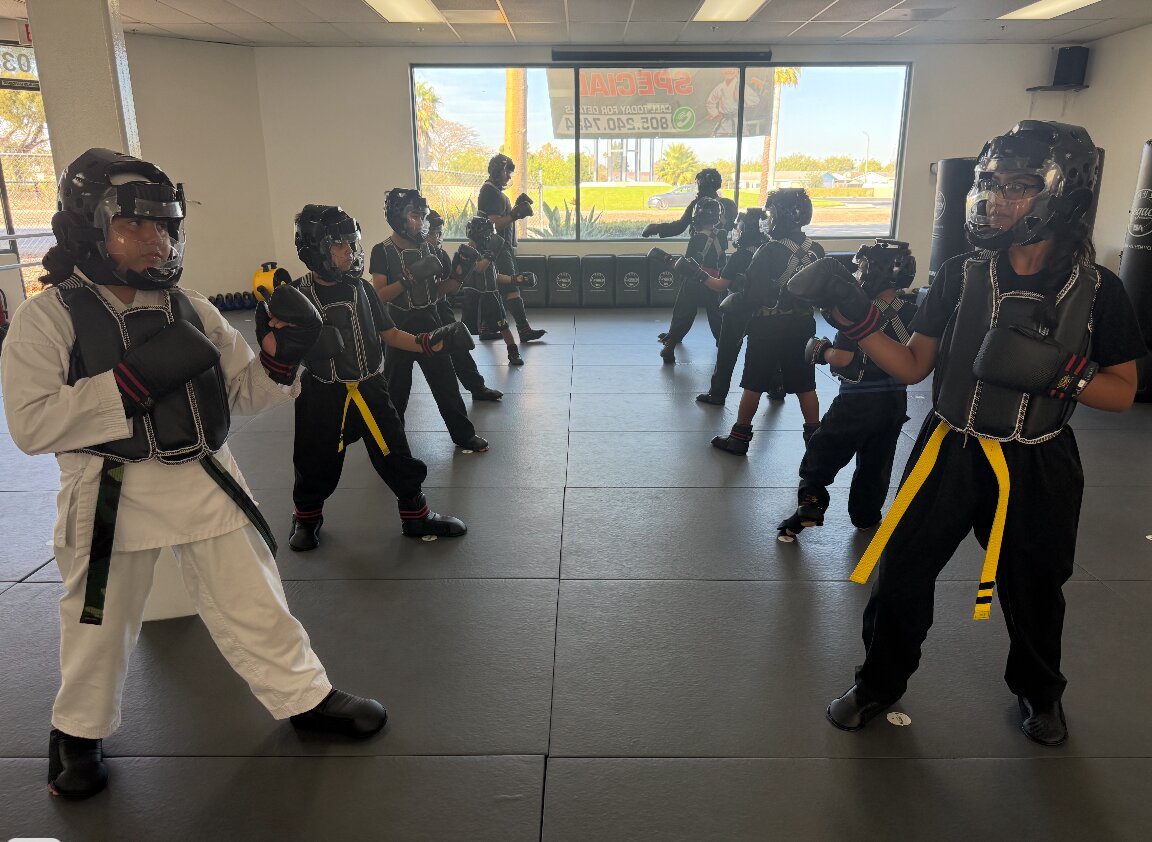 Youth sparring class in full gear at Legacy Martial Arts