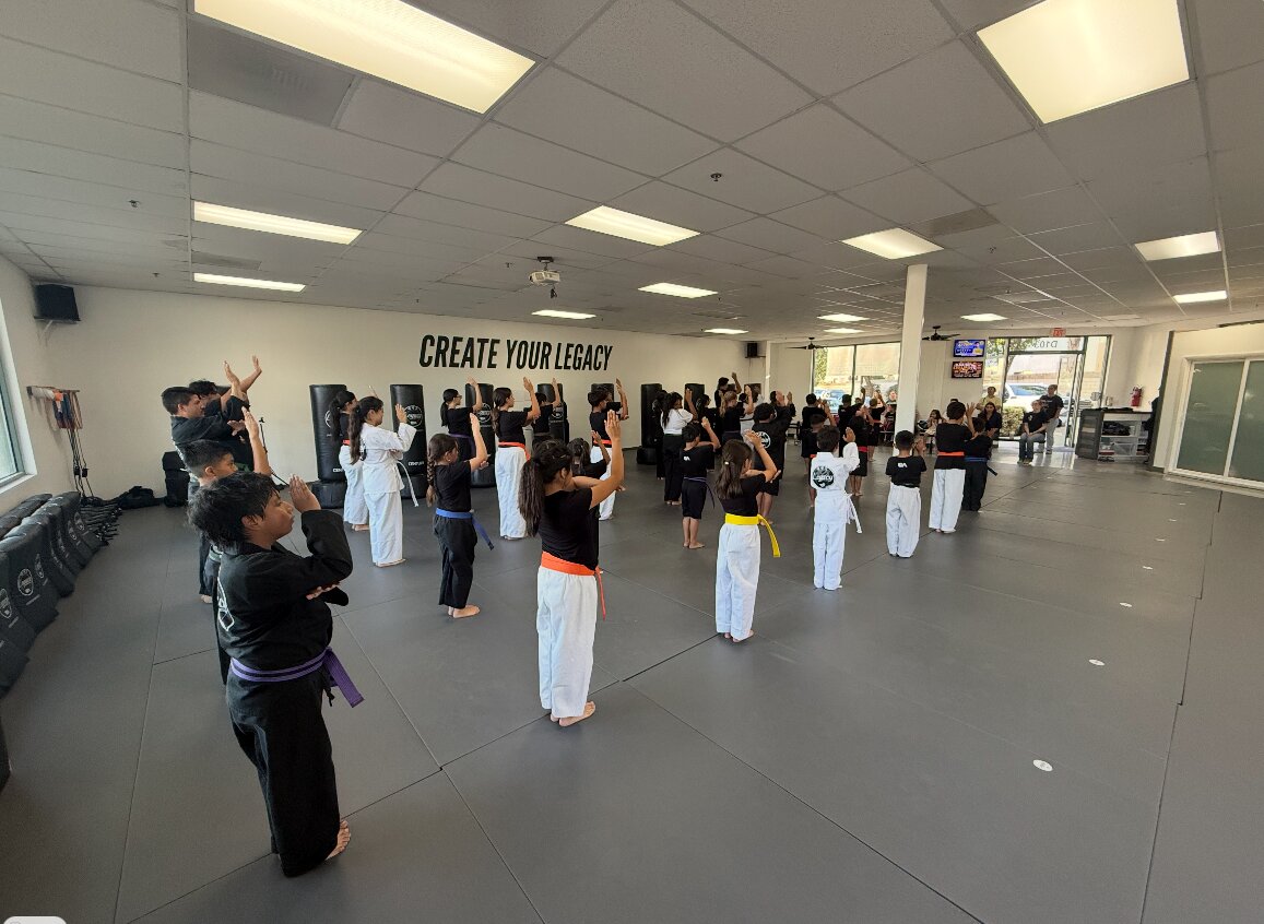 A full youth martial arts class training on the mat at Legacy Martial Arts in Oxnard