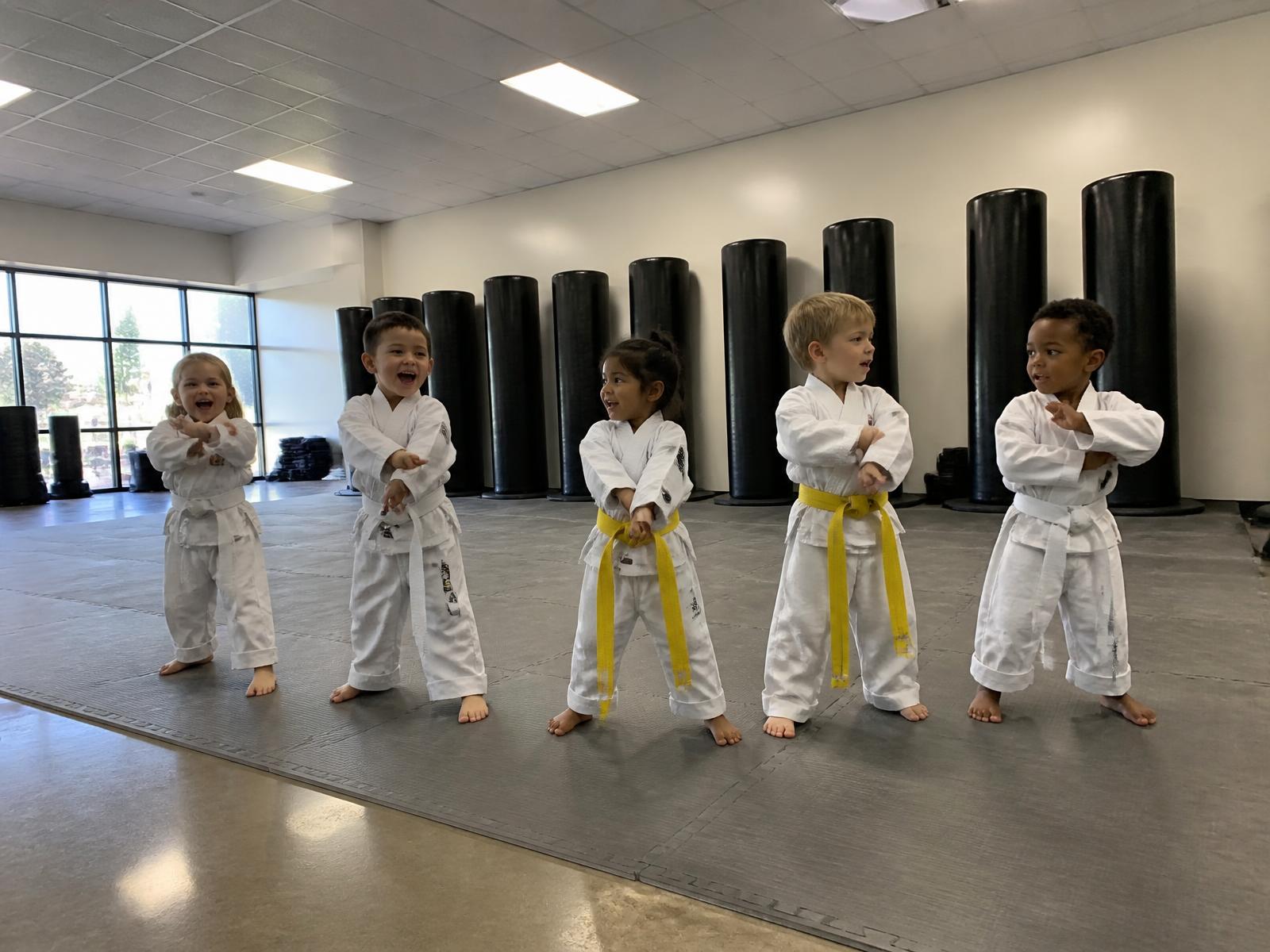 Preschoolers in white uniforms training in a Mighty Badgers class at Legacy Martial Arts in Oxnard